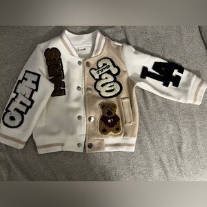 An infant fashion varsity jacket